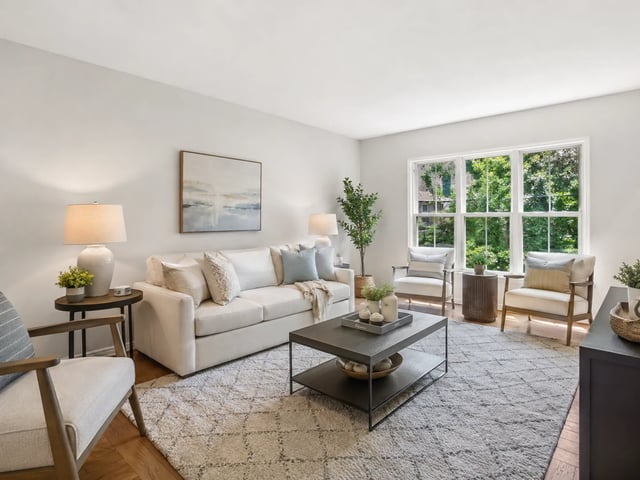 Real estate listing gallery tile with a virtually staged living room still